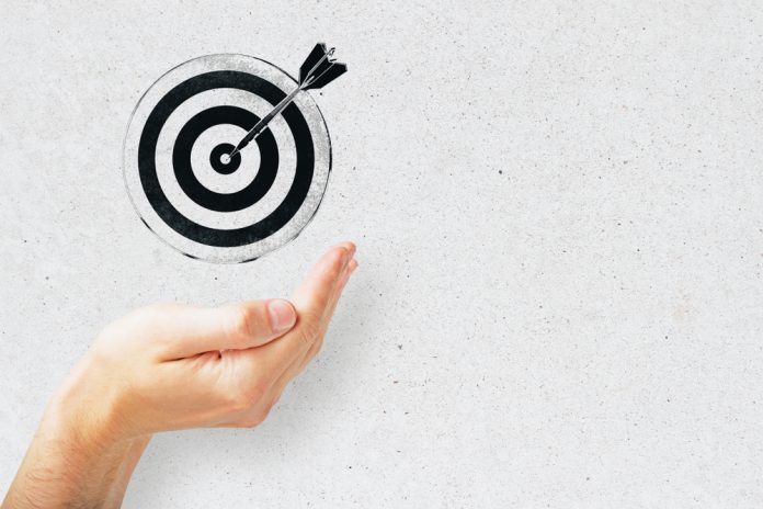 bullseye is a target of business, dart is an opportunity and dartboard is the target and goal. challenge in business marketing concept.